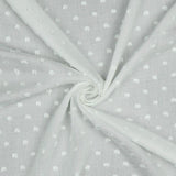 Viscose dobby textured spot polkadot dress fabric. Sage green and white