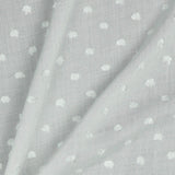 Viscose dobby textured spot polkadot dress fabric. Sage green and white